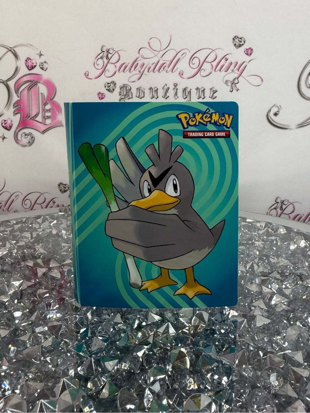 Pokemon trading card book Gray Duck Card Binder with Teal/Blue Swirl Background